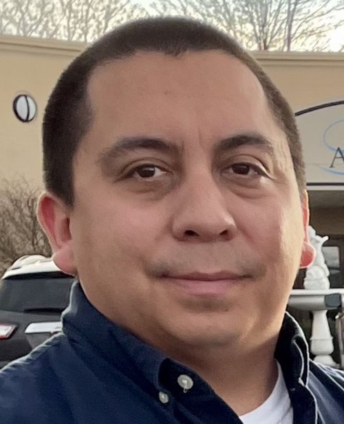 Jordan Printup, coordinator for vision for success program, wearing blue collared shirt